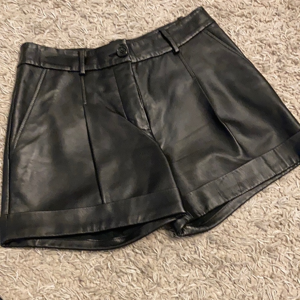 Elizabeth and James black leather pleated shorts.